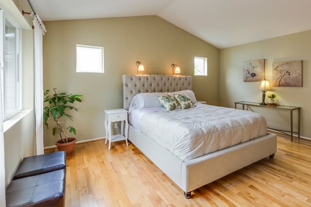 How To Arrange Furniture In A Small Bedroom (Arrange Like A Pro) photo of a minimal bedroom