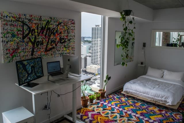 How To Arrange Furniture In A Small Bedroom (Arrange Like A Pro) how to place an area rug under a bed