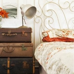 Stack old suitcases to make a vintage nightstand
